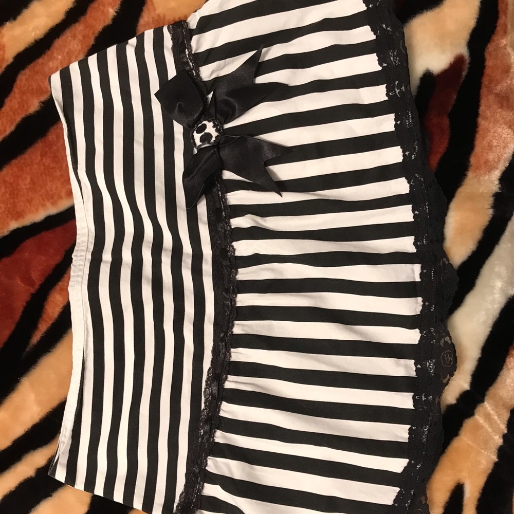 Black and white striped skirt with skull bow